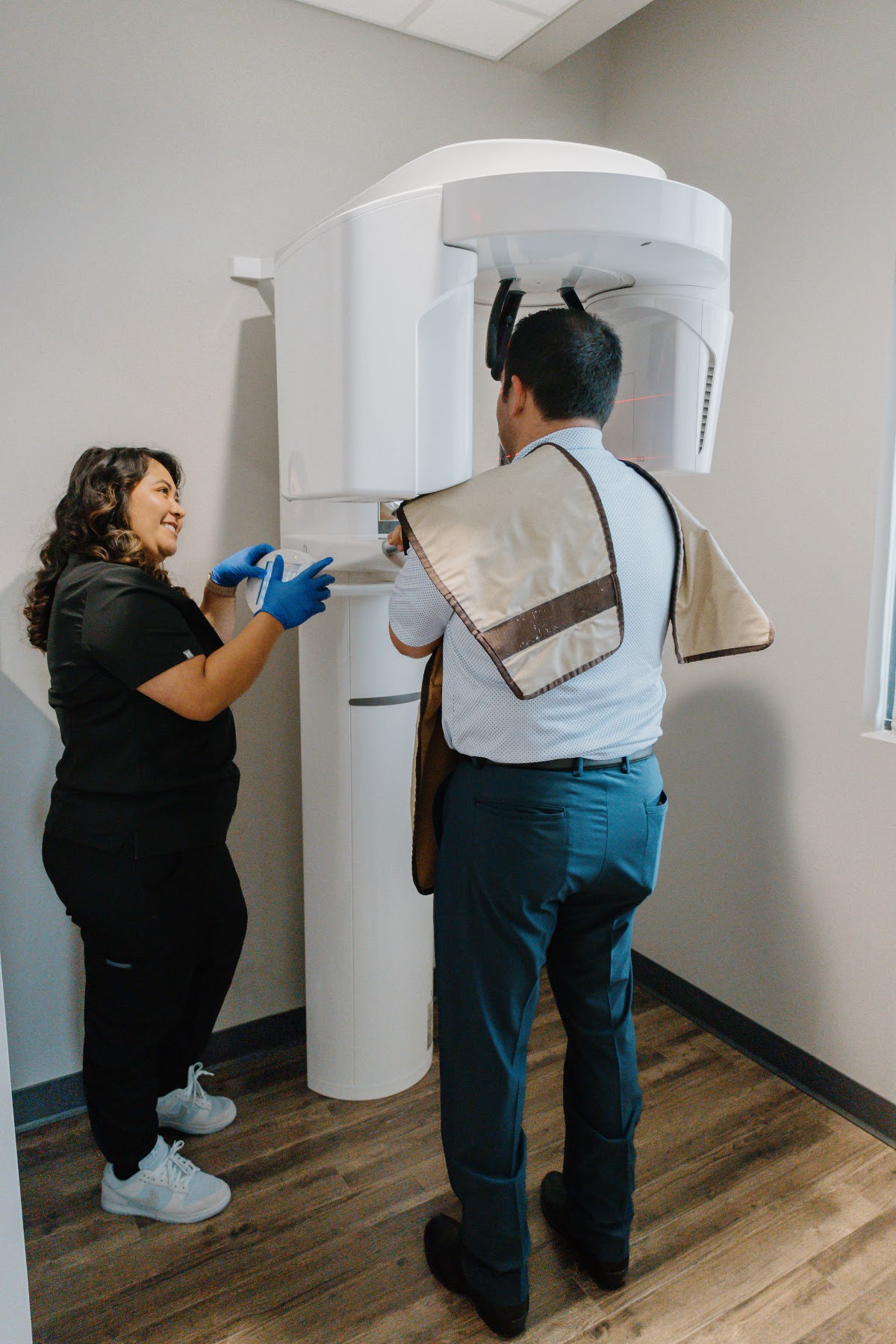 Transcend team member positioning a patient for a 3D CBCT scan