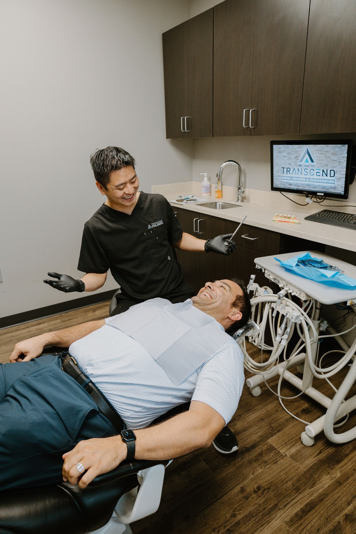 Dr. Trung Tran treating a patient in the operatory